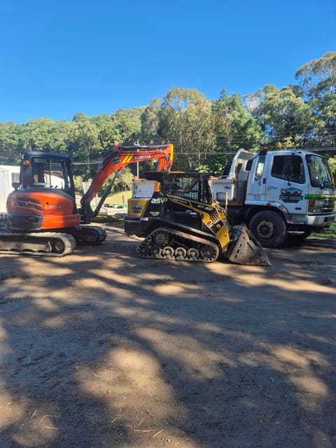Dirt Werks Kubota U55-4 excavator, ASV RT-60 posi-track and Fuso Fighter tipper parked side by side